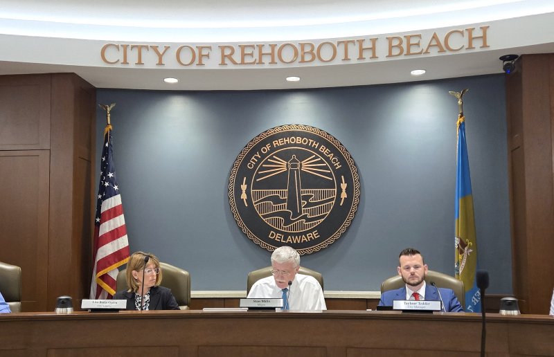 Rehoboth Beach City Manager Taylour Tedder has declined to pursue a merit pay increase that is allowed in his contract. Mayor Stan Mills announced the decision during a meeting June 9. Shown are (l-r) City Solicitor Lisa Borin Ogden, Mayor Stan Mills and City Manager Taylour Tedder. CHRIS FLOOD PHOTO